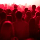 cheerful-people-partying-live-concert-red-stage-lights-76098_10_11zon